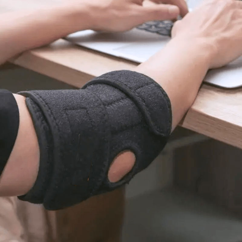 cotoveleira de compressão em neoprene com hastes estabilizadoras